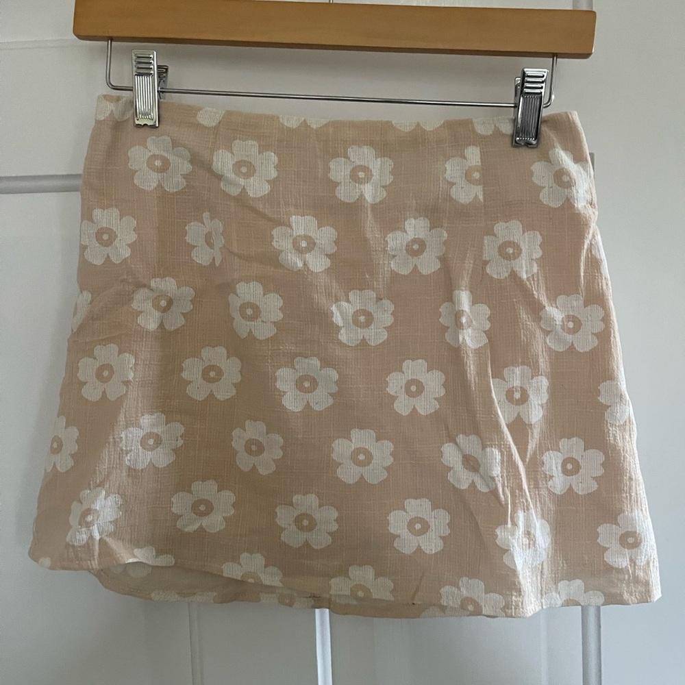 Princess Polly mini beige floral skirt.